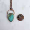 Blue Opal and Copper pendant shown beside a Canadian Quarter coin.