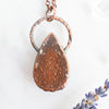 Backside of Copper electroformed pendant showing the texturized detailing.