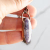 Lepidolite and Copper electroformed pendant shown in human hand, side angle view details showing.