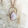 Soothing Pink Australian Opal and copper pendant shown against a Quartz background.