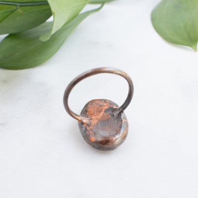 Backview of a Peach Moonstone and Copper Ring showing the detail and patina of the metal.