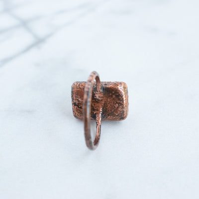 Back view of a Peach Moonstone and Copper ring shows the detail and patina on the pure copper.