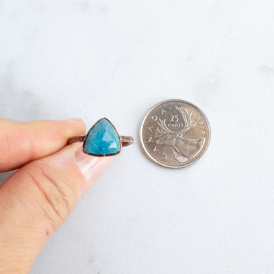 Blue Apatite and Copper ring beside a Canadian Quarter coin.