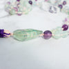 Incredible iridescent rainbow can be seen in the Rainbow Flourite Guru bead.