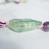 Incredible iridescent rainbow can be seen in the Rainbow Flourite Guru bead.