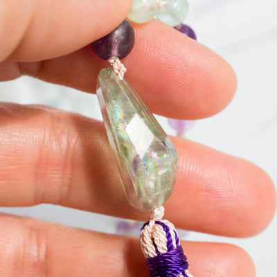 Incredible iridescent rainbow can be seen in the Rainbow Flourite Guru bead.