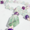 Green, clear and purple banding shown in the Rainbow Flourite Guru bead.