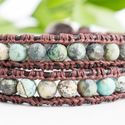 Close up photo shows the details of the African Turquoise beads in this leather wrap bracelet.