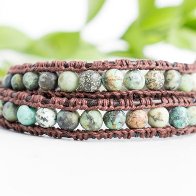 Close up photo shows the details of the African Turquoise beads in this leather wrap bracelet.