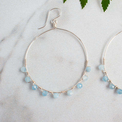 Cool blue faceted Aquamarine and Silver plated hoop earrings.