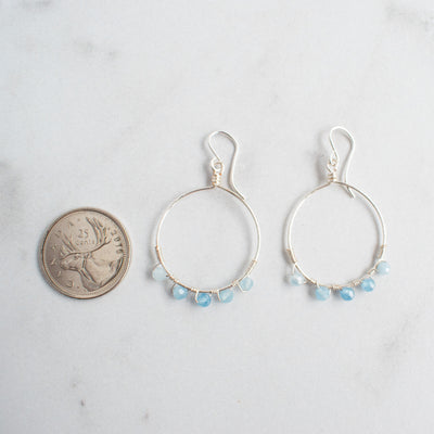 Canadian Quarter shown next to Aquamarine and silver plated hoop earrings for size reference.